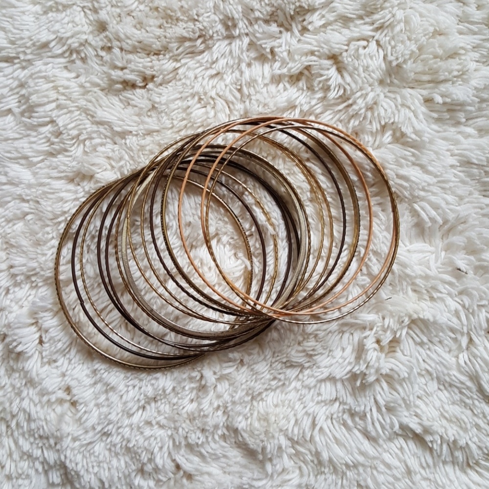 Bundle of gold and brown bracelets